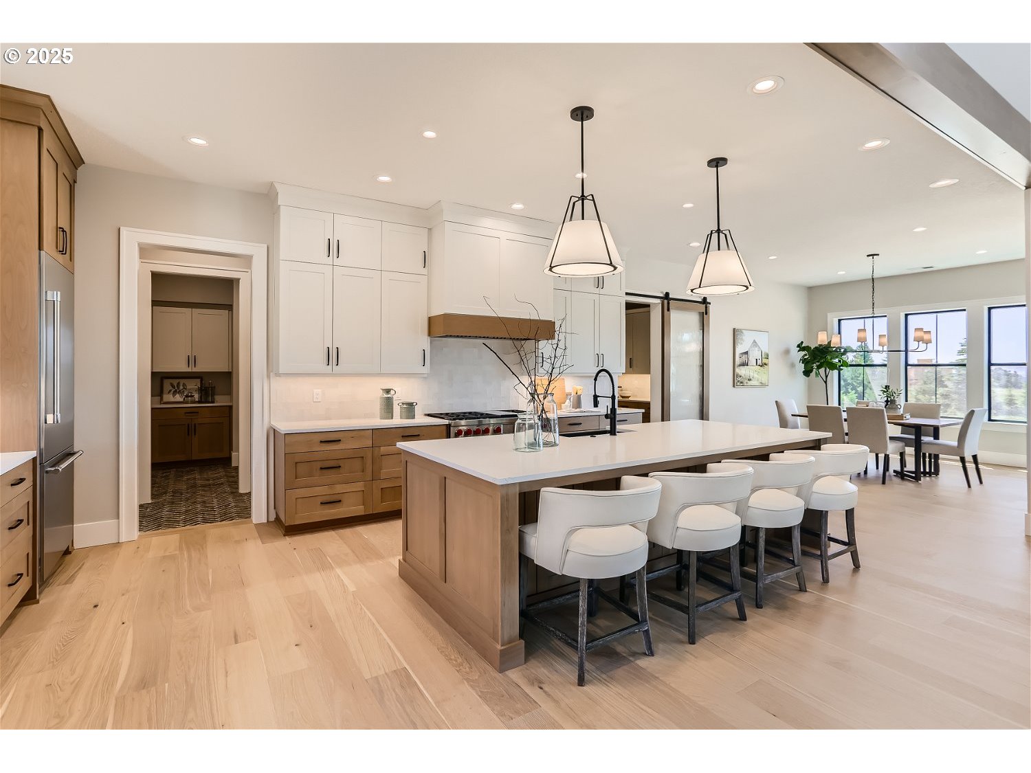 7705 Southwest Alden Street Portland, OR 97223 - Photo 11 of 30 a large kitchen with lots of counter space and stainless steel appliances