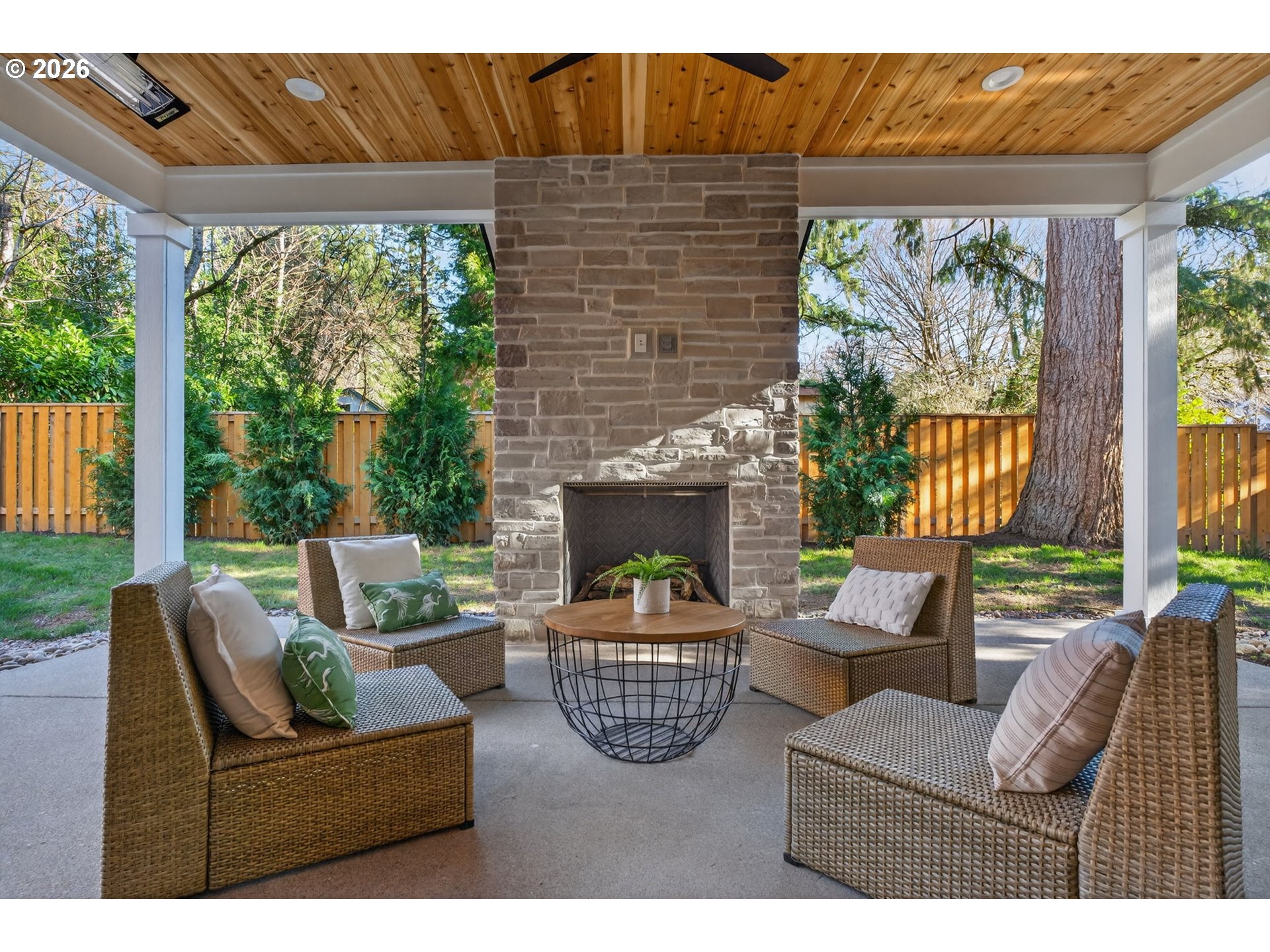 7705 Southwest Alden Street Portland, OR 97223 - Photo 23 of 30 a living room with furniture a fireplace and a large window