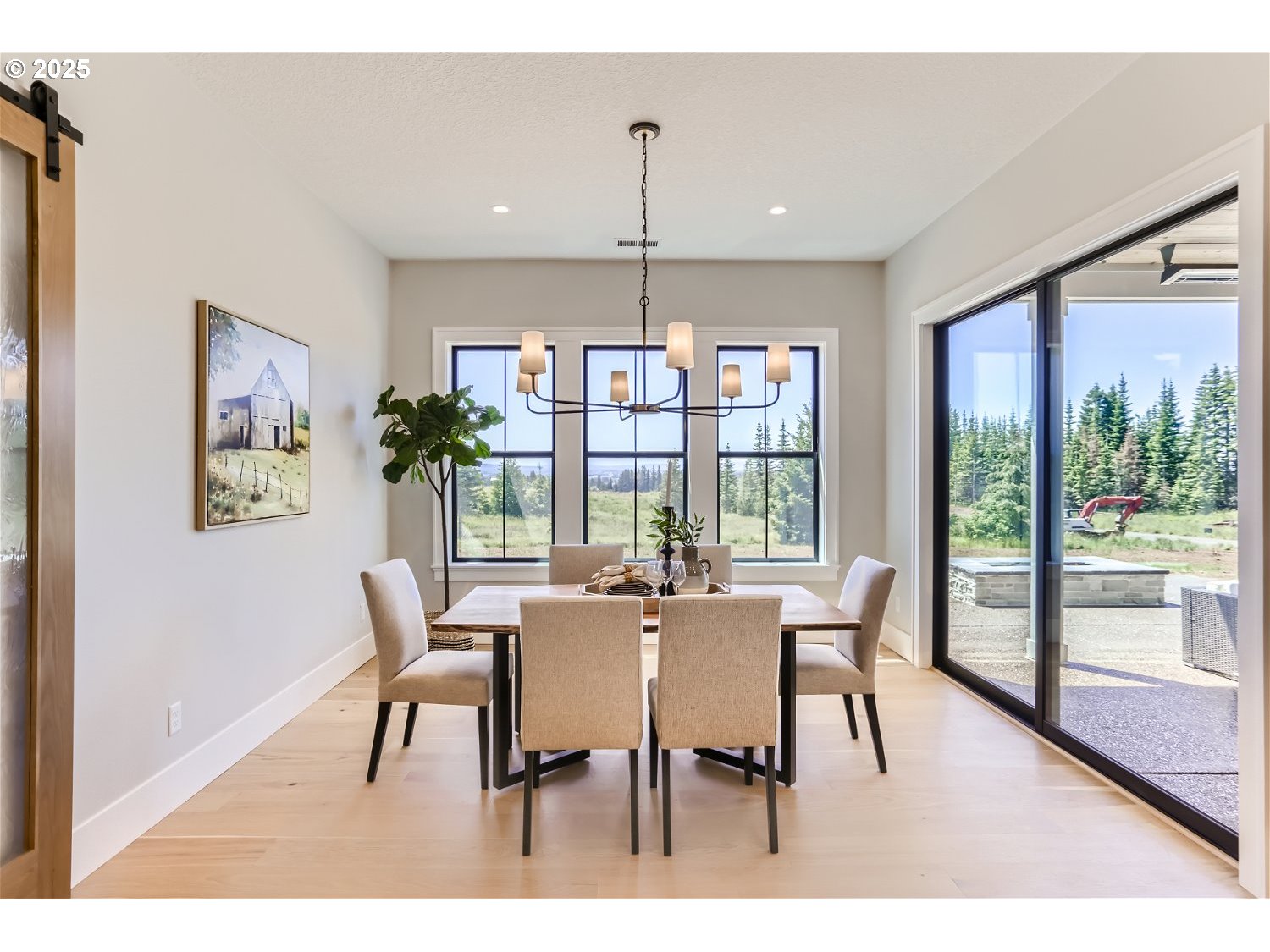 7705 Southwest Alden Street Portland, OR 97223 - Photo 7 of 30 a view of a dining room with furniture large windows and wooden floor