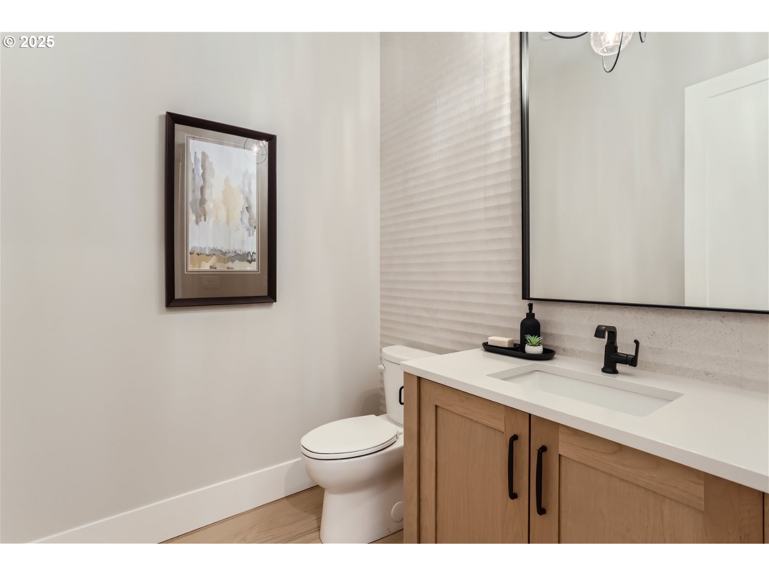 7705 Southwest Alden Street Portland, OR 97223 - Photo 8 of 30 a bathroom with a toilet sink and mirror