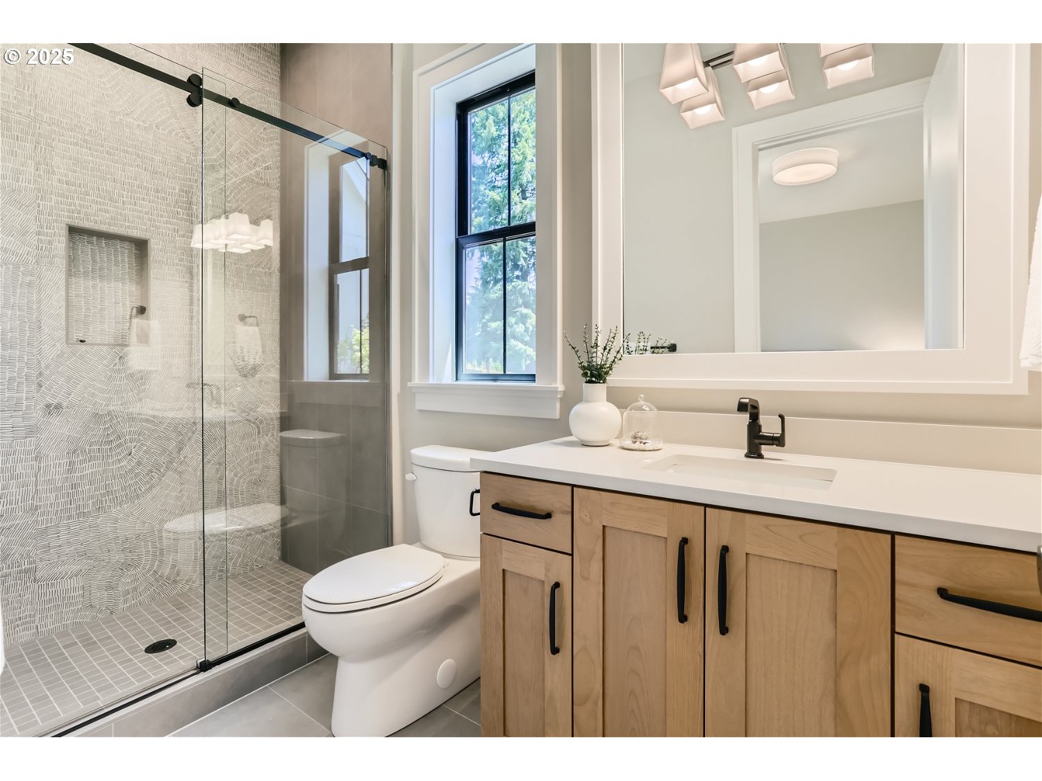 7705 Southwest Alden Street Portland, OR 97223 - Photo 10 of 30 a bathroom with a granite countertop sink a toilet and a mirror