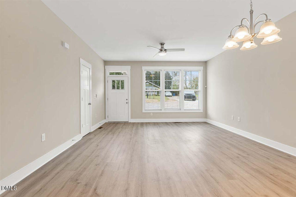 2305 Hill Street Raleigh, NC 27604 - Photo 17 of 26 wooden floor in an empty room with a window