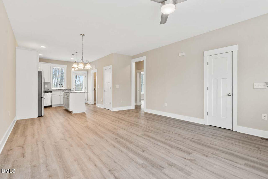 2305 Hill Street Raleigh, NC 27604 - Photo 19 of 26 a view of a kitchen with a refrigerator and a sink