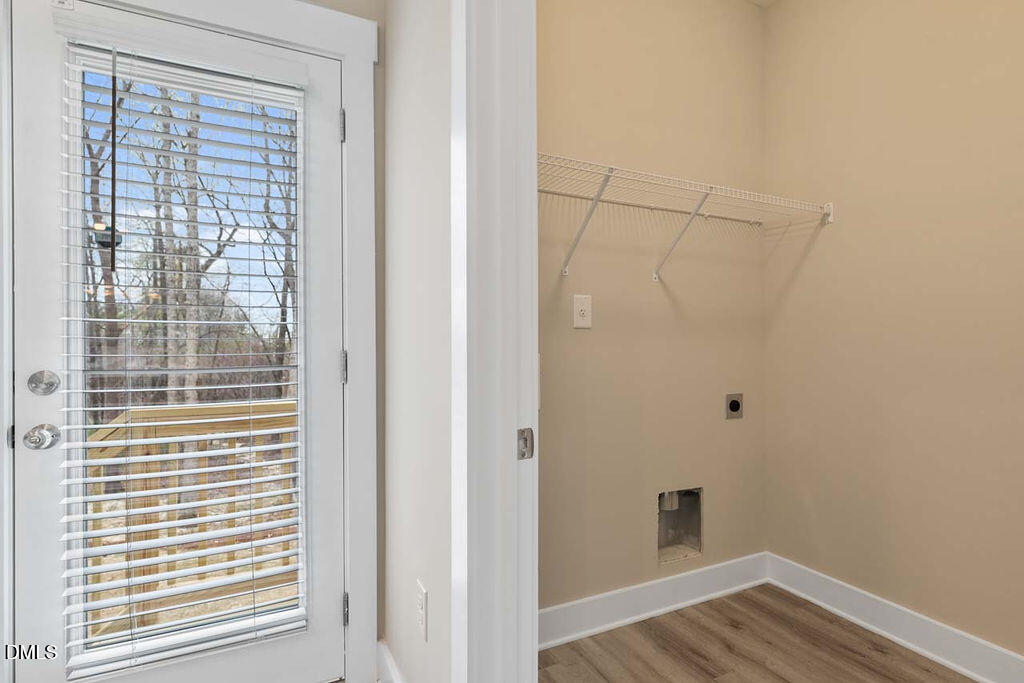 2305 Hill Street Raleigh, NC 27604 - Photo 25 of 26 a view of a small space with wooden floor and a window