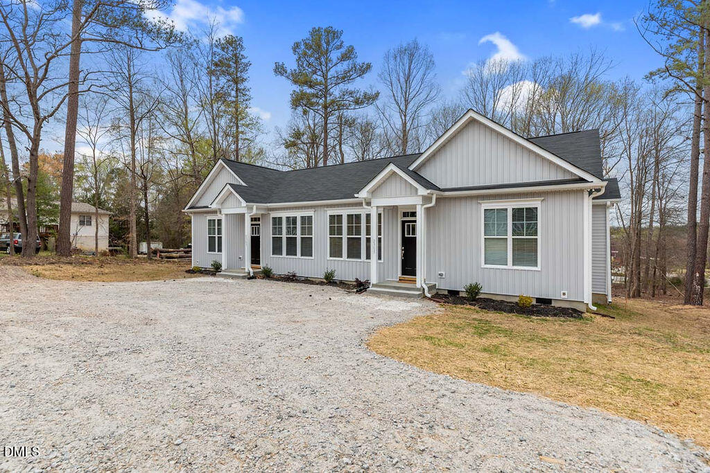 2305 Hill Street Raleigh, NC 27604 - Photo 3 of 26 a front view of a house with a garden