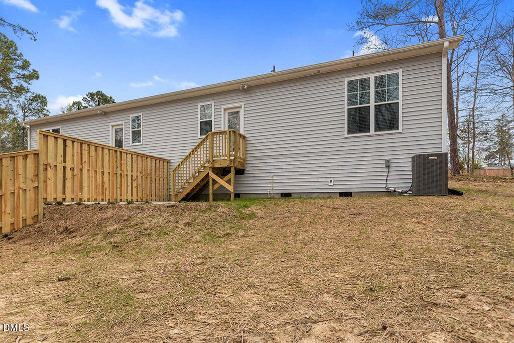 2305 Hill Street Raleigh, NC 27604 - Photo 4 of 26 a view of a house with a backyard