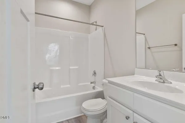 a bathroom with a sink a toilet and a bathtub