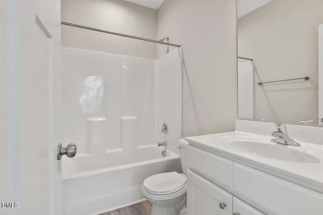 a bathroom with a sink a toilet and a bathtub