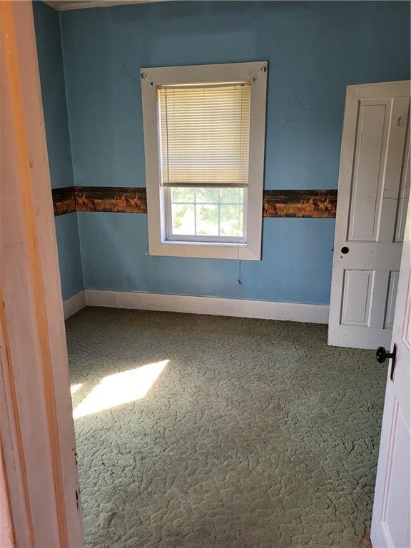 734 Main Street Addison, PA 15411 - Photo 13 of 27 an empty room with a window