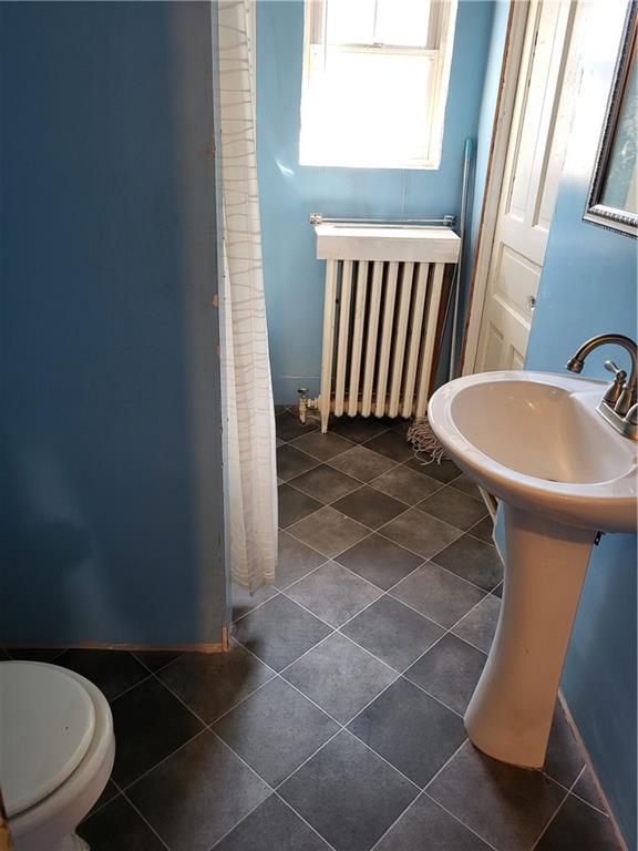 734 Main Street Addison, PA 15411 - Photo 17 of 27 a bathroom with a sink toilet and mirror