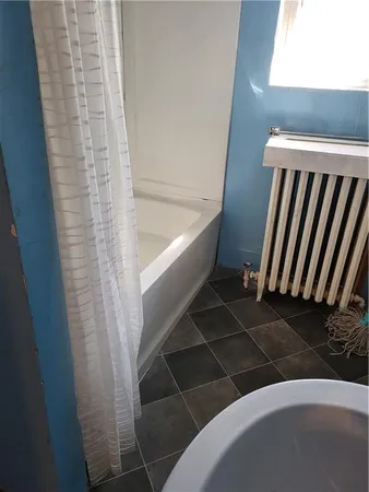 a bathroom with a sink and a shower