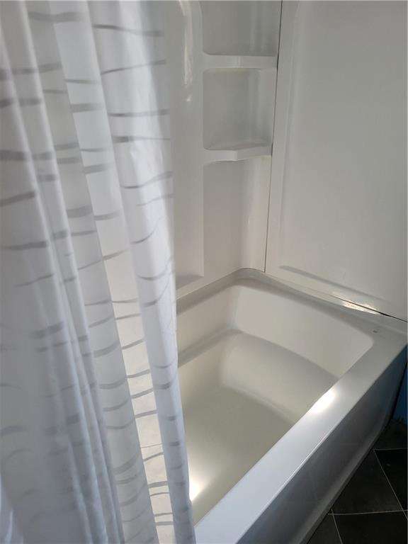 734 Main Street Addison, PA 15411 - Photo 19 of 27 a bathroom with a bathtub