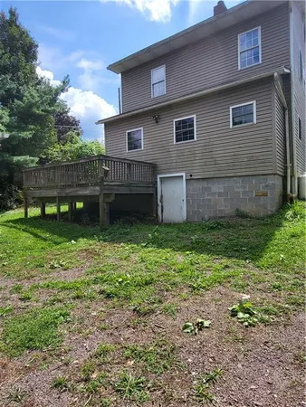 a backyard of a house with lots of green space