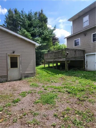 a backyard of a house with lots of green space
