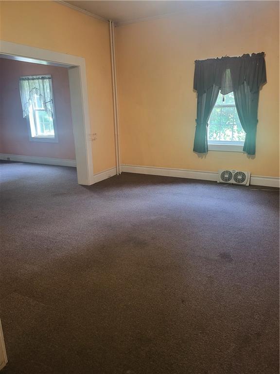 734 Main Street Addison, PA 15411 - Photo 4 of 27 an empty room with windows