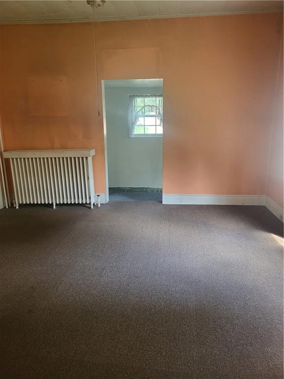 734 Main Street Addison, PA 15411 - Photo 5 of 27 an empty room with windows