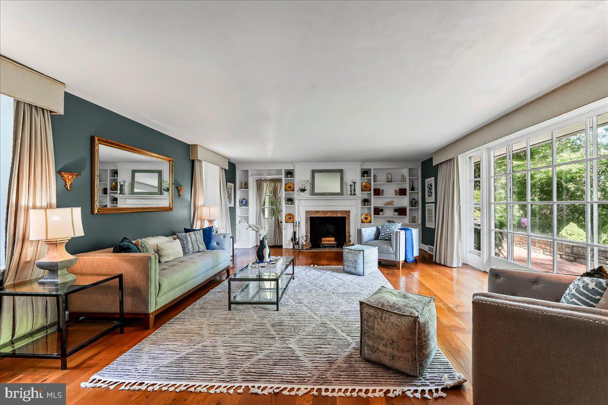 716 Old Gulph Road Bryn Mawr, PA 19010 - Photo 3 of 58 a living room with fireplace furniture and a large window