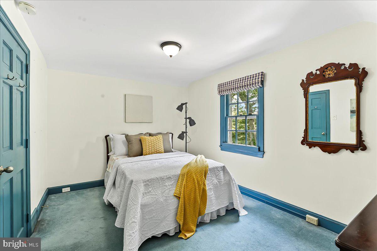 716 Old Gulph Road Bryn Mawr, PA 19010 - Photo 42 of 58 a bedroom with a bed and window