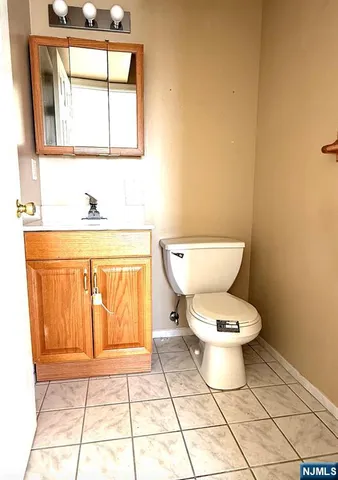 a bathroom with a toilet a sink and bathtub