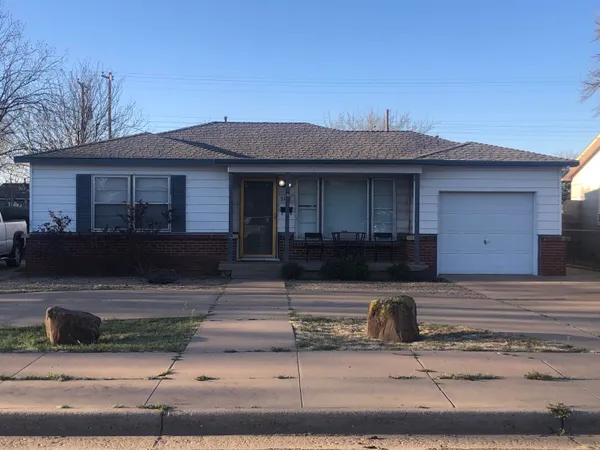 a front view of a house with garage