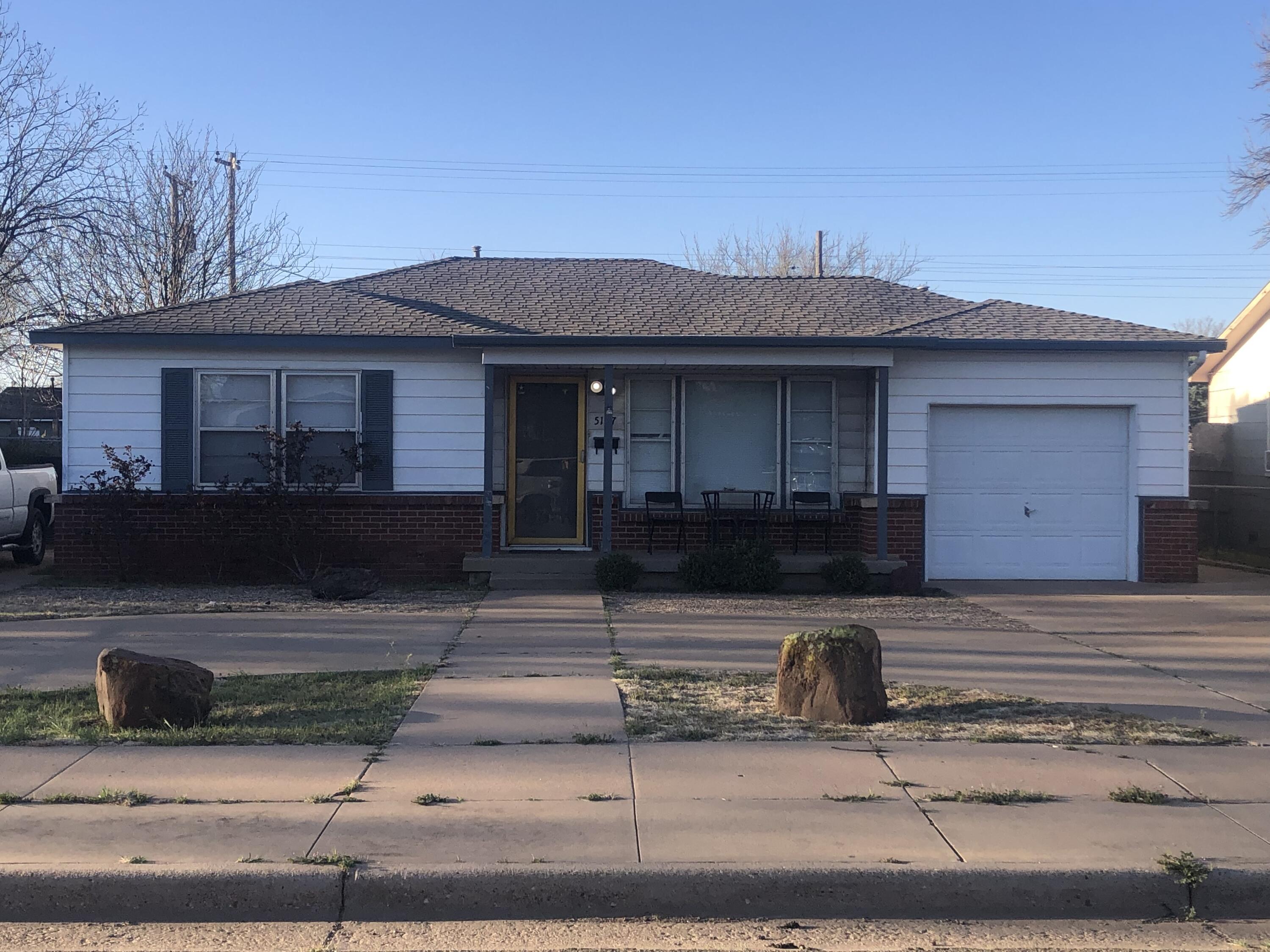 a front view of a house with garage