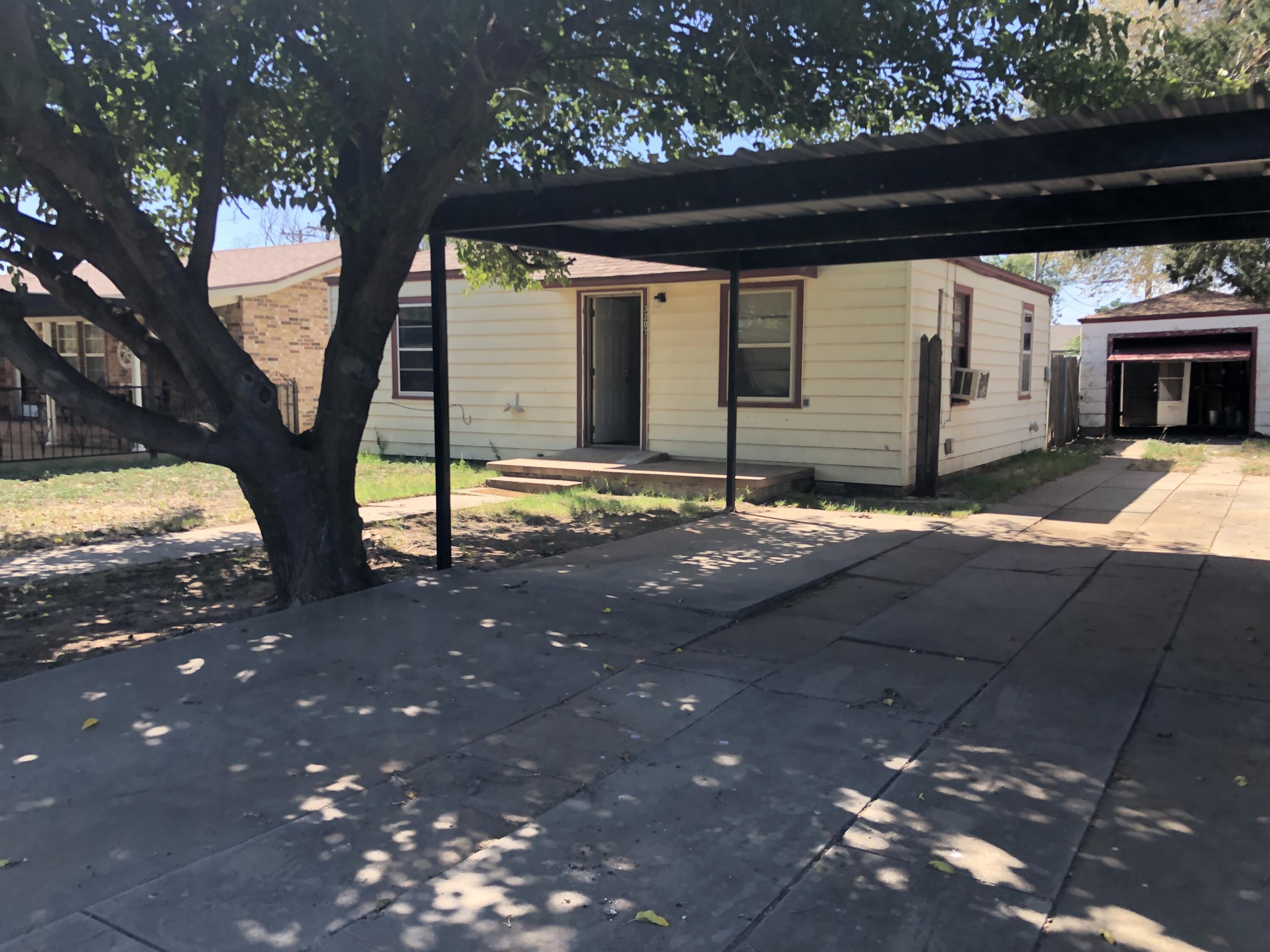 5107 40th Street Lubbock, TX 79414 - Photo 4 of 10 a view of house with yard