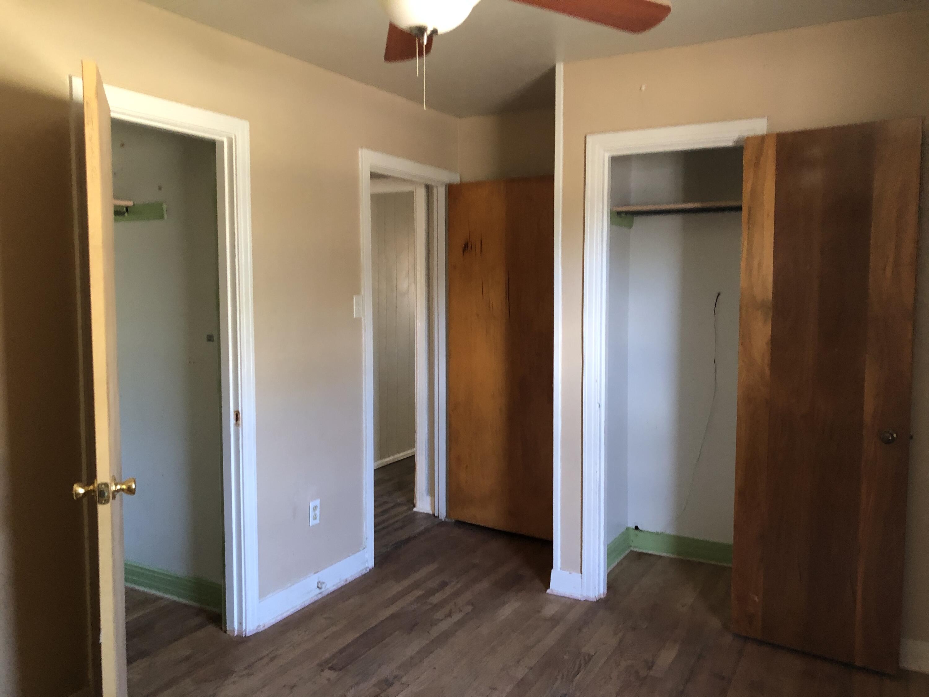 5107 40th Street Lubbock, TX 79414 - Photo 5 of 10 an empty room with closet and wooden floor