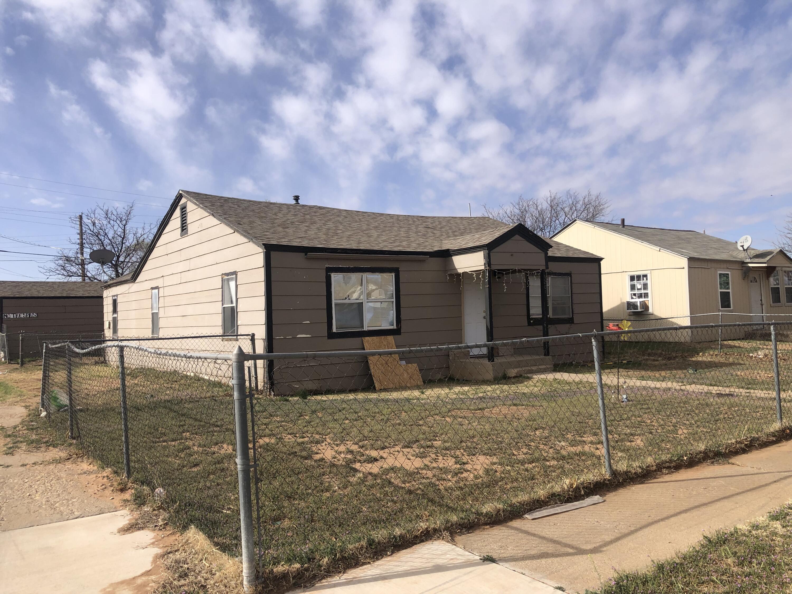 5107 40th Street Lubbock, TX 79414 - Photo 9 of 10 a front view of a house with garden