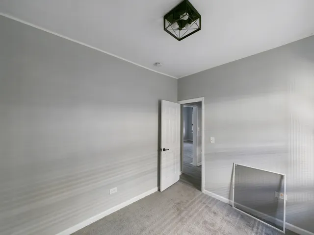 an empty room with a elevator