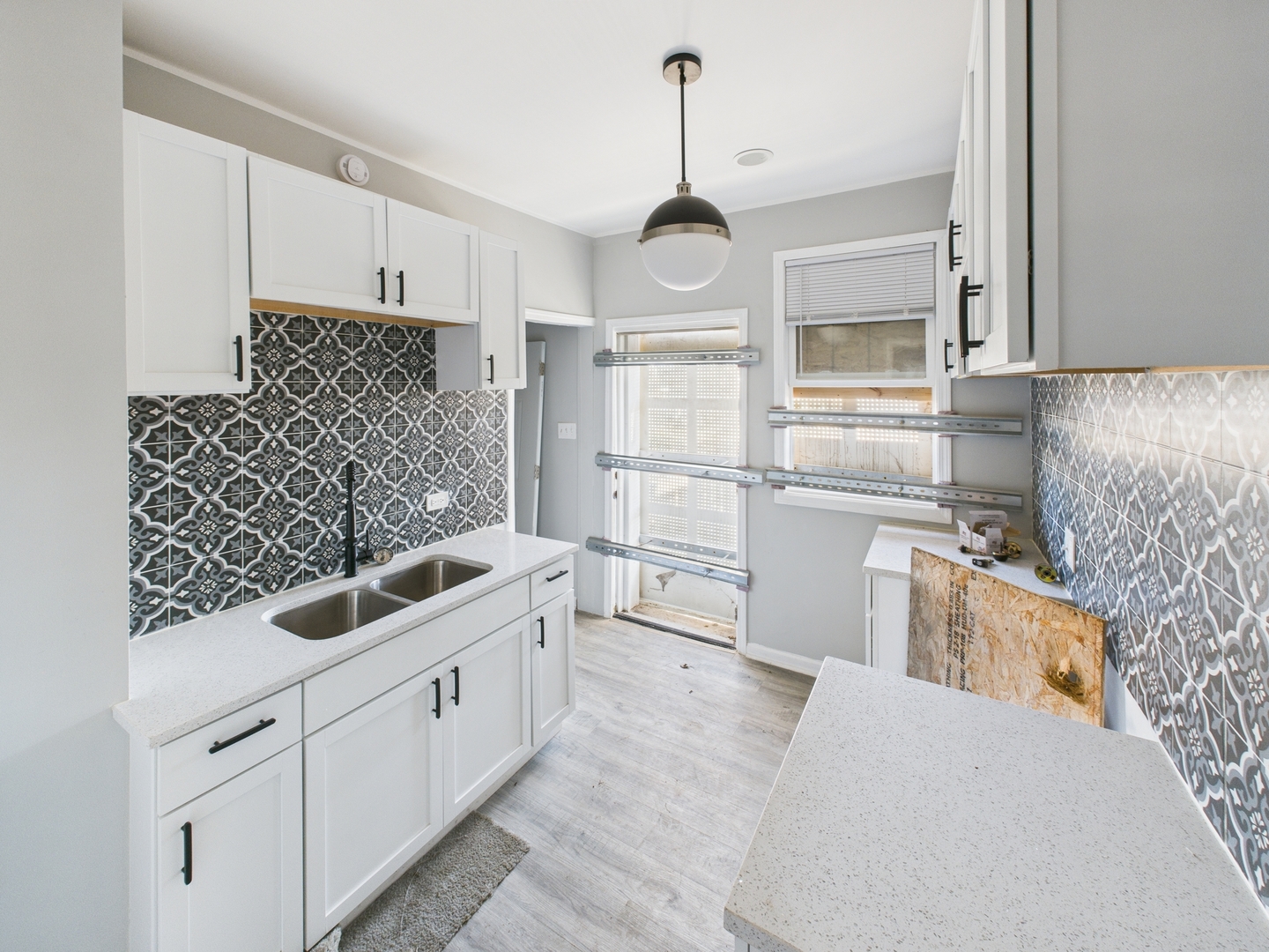 7425 South Perry Avenue Chicago, IL 60621 - Photo 12 of 16 a kitchen with stainless steel appliances a sink stove and refrigerator
