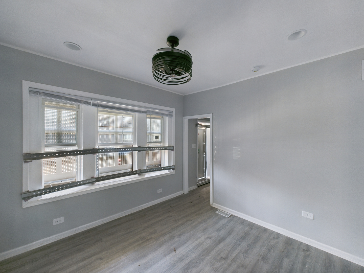 7425 South Perry Avenue Chicago, IL 60621 - Photo 3 of 16 a view of an empty room with a window