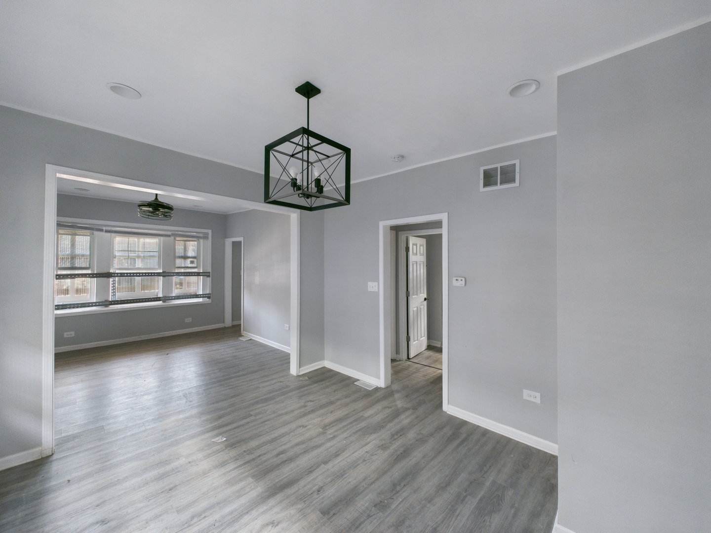 7425 South Perry Avenue Chicago, IL 60621 - Photo 6 of 16 a view of a room wooden floor and window