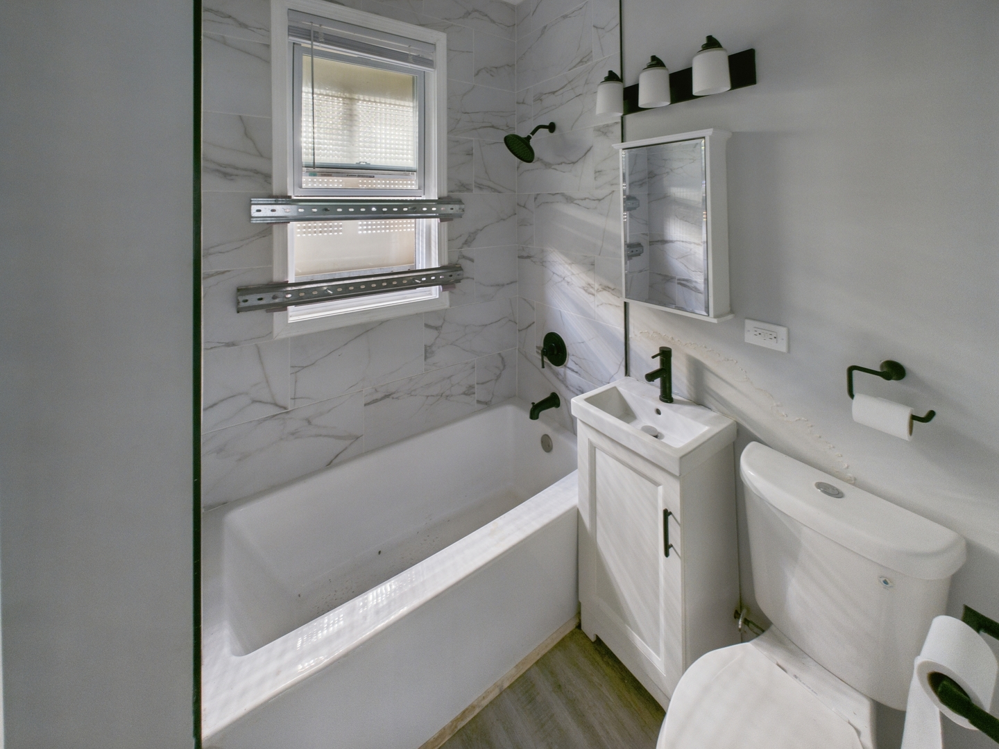7425 South Perry Avenue Chicago, IL 60621 - Photo 9 of 16 a bathroom with a bathtub sink and toilet