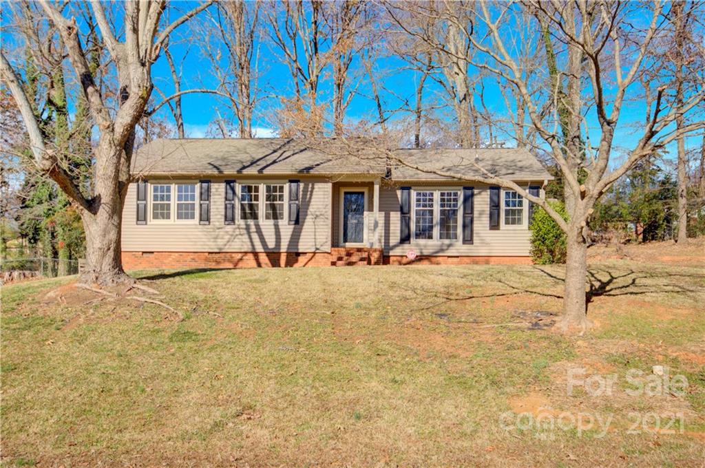 7243 Fox Hunt Road Charlotte, NC 28212 - Photo 2 of 34 a front view of a house with a yard