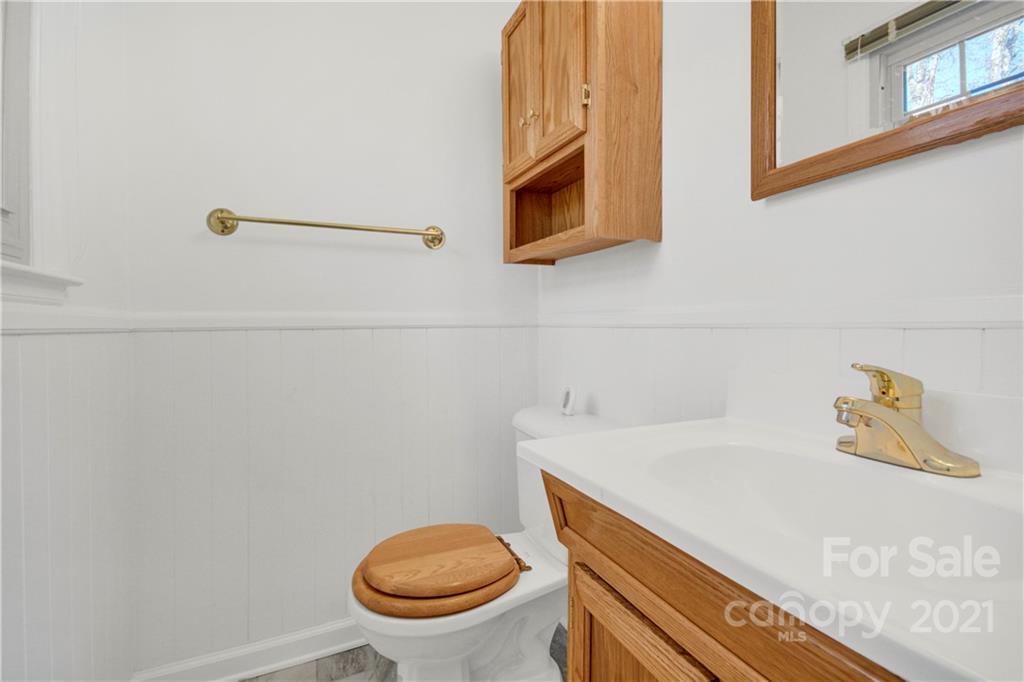7243 Fox Hunt Road Charlotte, NC 28212 - Photo 13 of 34 a bathroom with a sink and a toilet