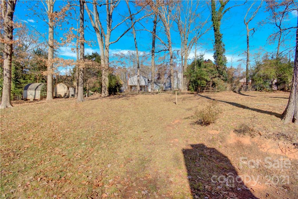 7243 Fox Hunt Road Charlotte, NC 28212 - Photo 28 of 34 a street view with large trees