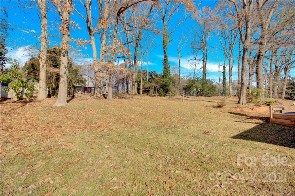 7243 Fox Hunt Road Charlotte, NC 28212 - Photo 33 of 34 a street view with large trees