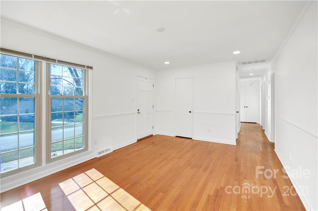 7243 Fox Hunt Road Charlotte, NC 28212 - Photo 6 of 34 a view of empty room with wooden floor and fan