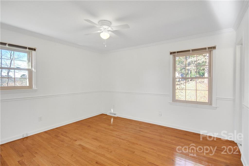 7243 Fox Hunt Road Charlotte, NC 28212 - Photo 10 of 34 an empty room with a window