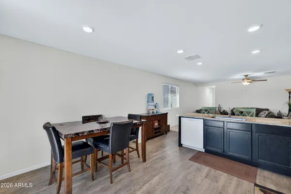 a kitchen with stainless steel appliances a sink stove and cabinets