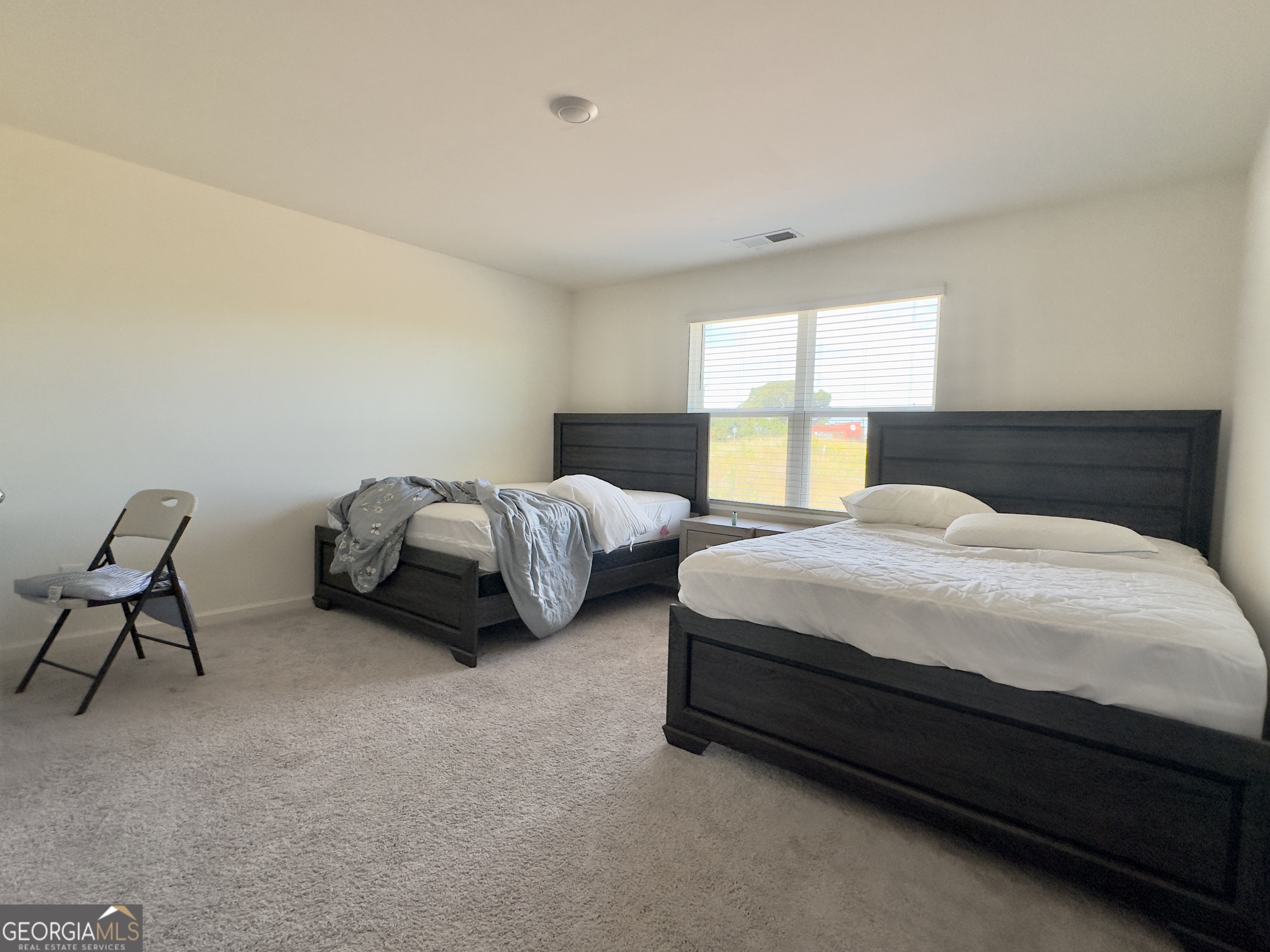 103 Ellicott Way Cartersville, GA 30120 - Photo 12 of 23 a spacious bedroom with two beds and a window