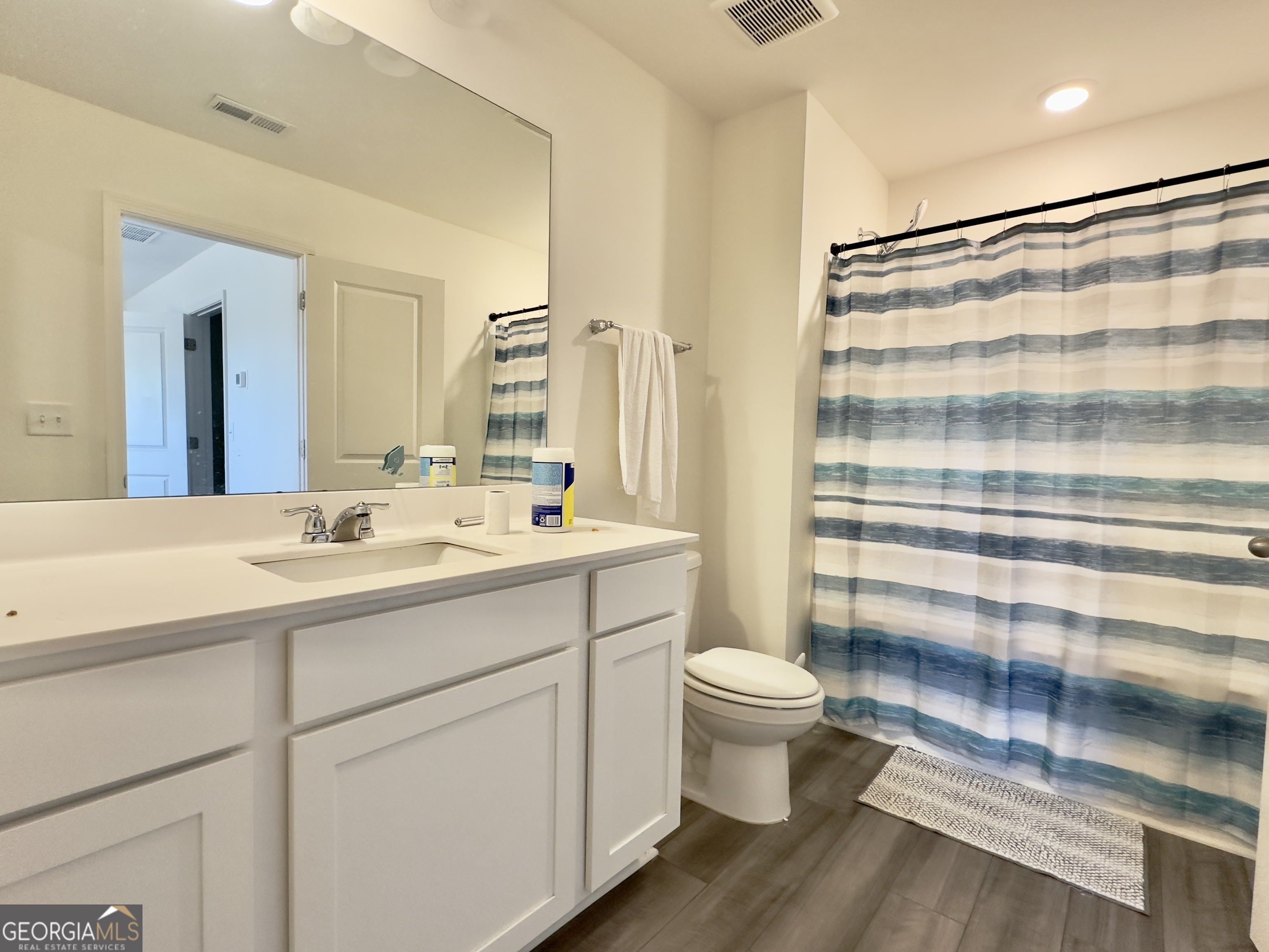 103 Ellicott Way Cartersville, GA 30120 - Photo 14 of 23 a bathroom with a sink a toilet a shower and a mirror