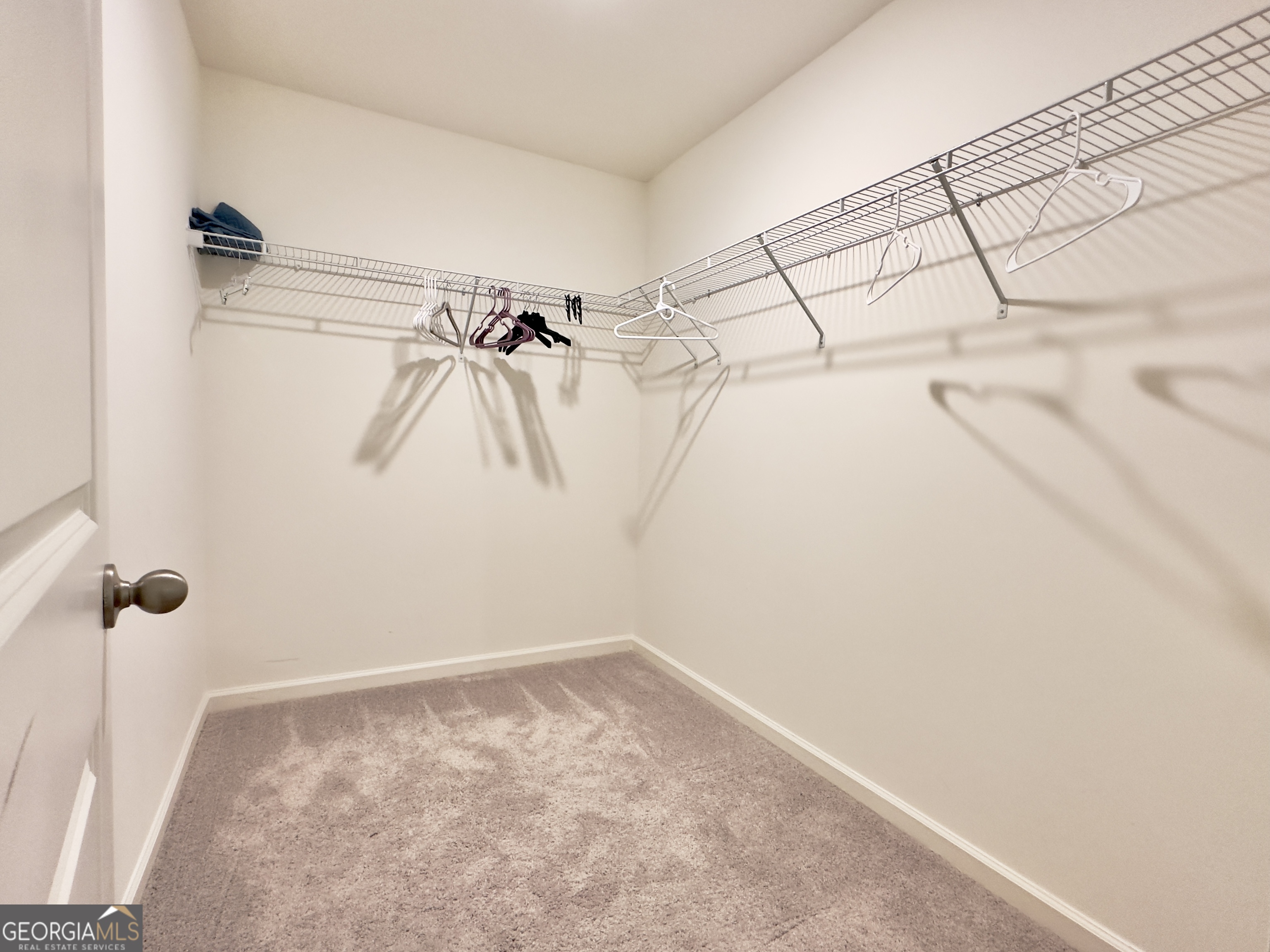 103 Ellicott Way Cartersville, GA 30120 - Photo 16 of 23 a view of a room with racks on the wall