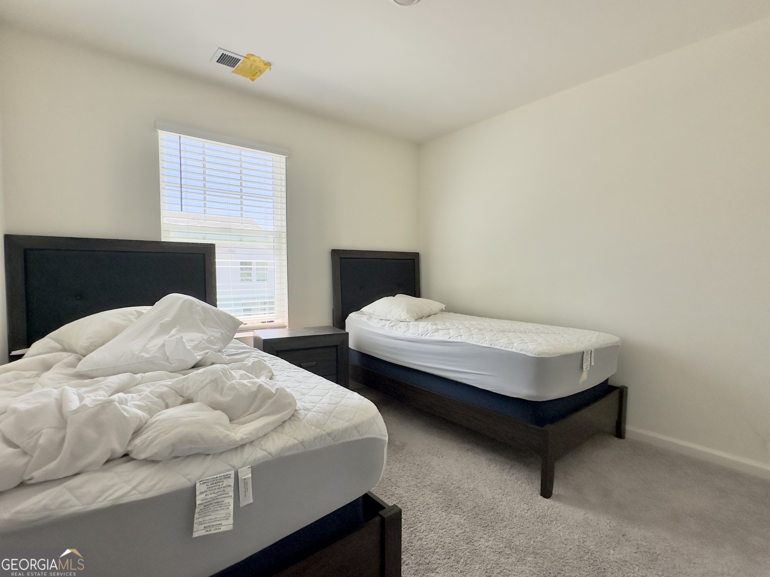 103 Ellicott Way Cartersville, GA 30120 - Photo 17 of 23 a bedroom with bed and a fireplace