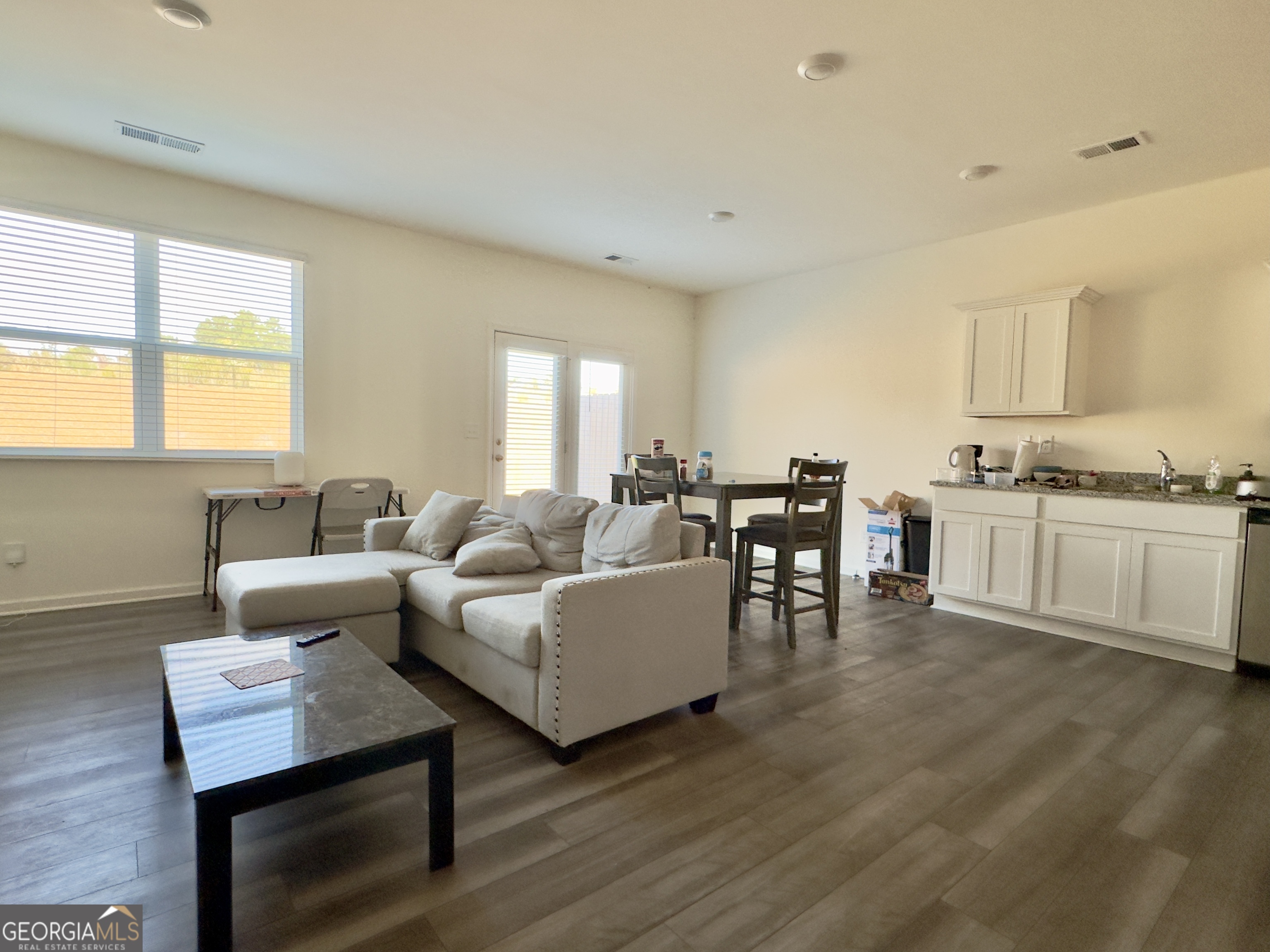 103 Ellicott Way Cartersville, GA 30120 - Photo 7 of 23 a living room with furniture and a wooden floor