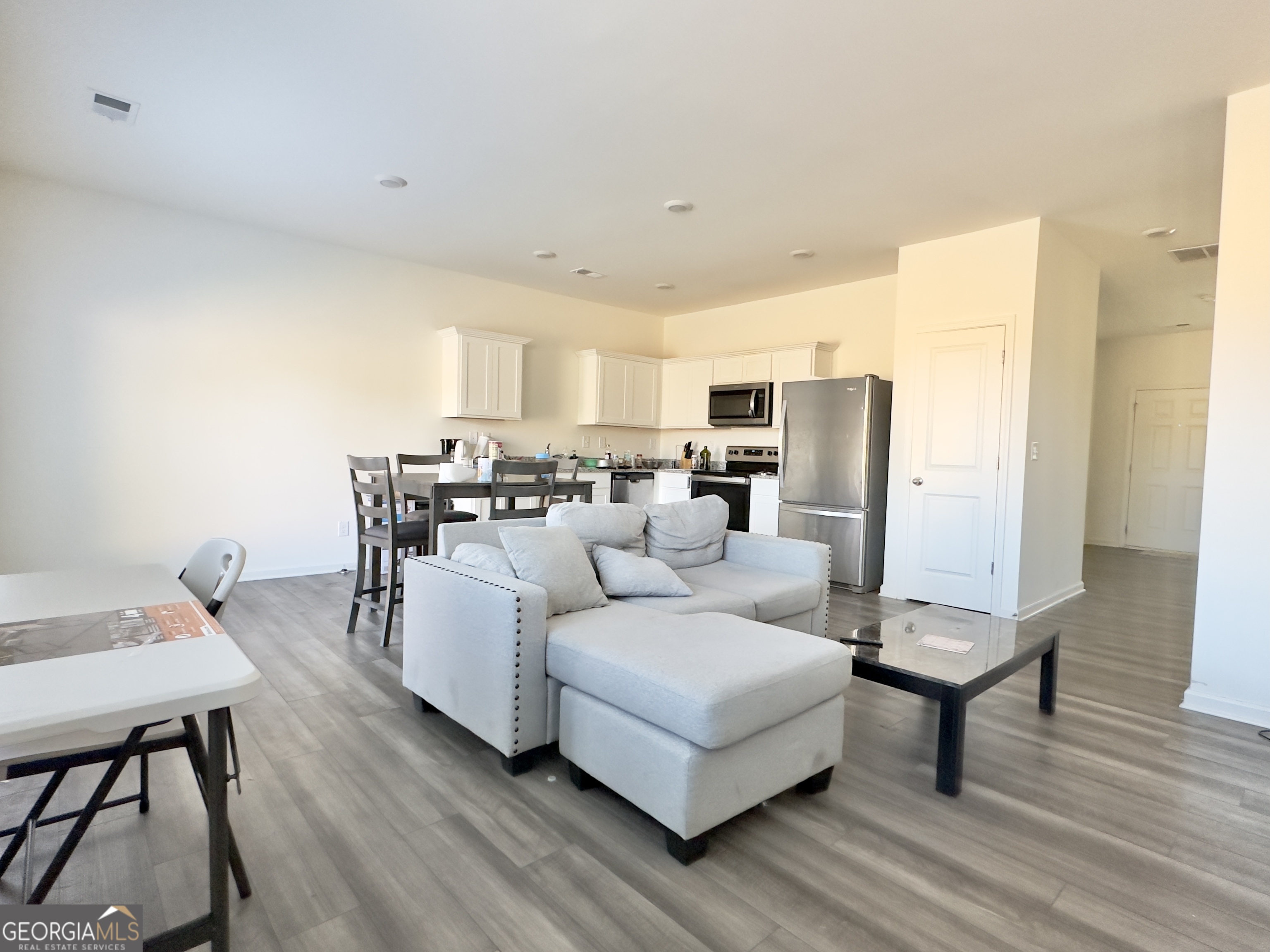 103 Ellicott Way Cartersville, GA 30120 - Photo 8 of 23 a living room with furniture and a table