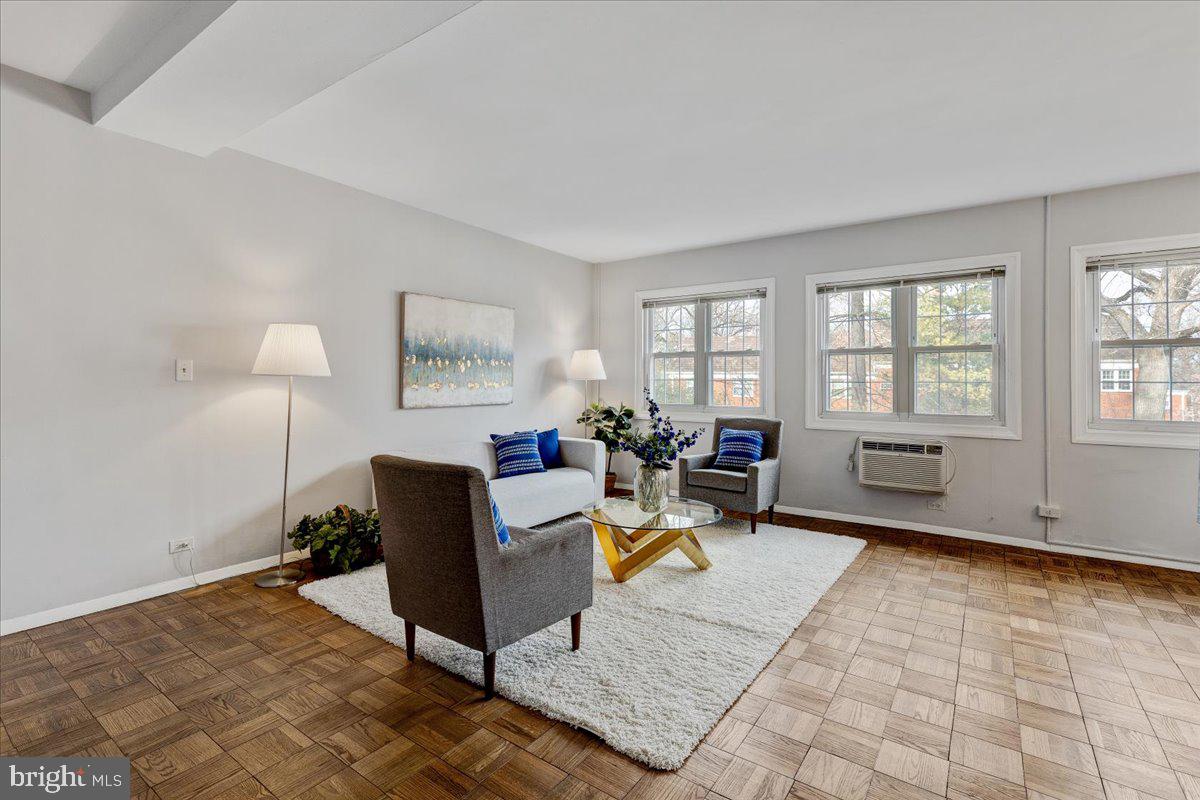 Refinished parquet floors in  light filled LR