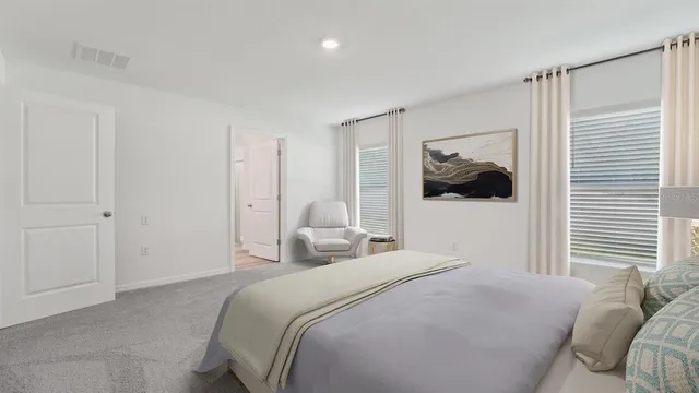 a bedroom with a bed and a wall painting