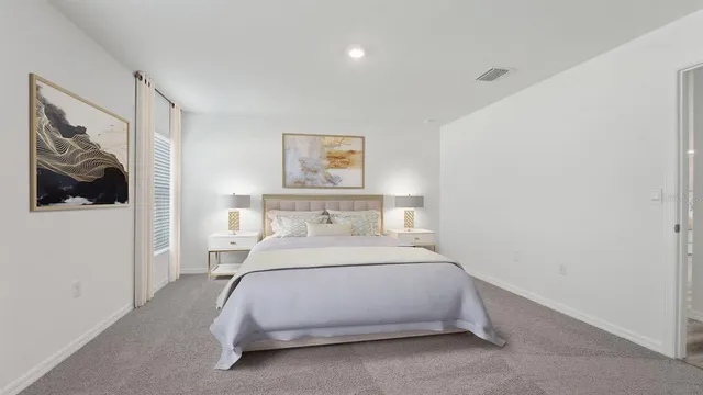 a bedroom with a bed and wall painting