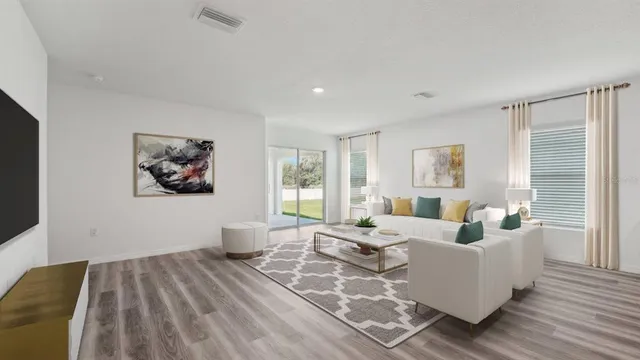 a bedroom with furniture and a window